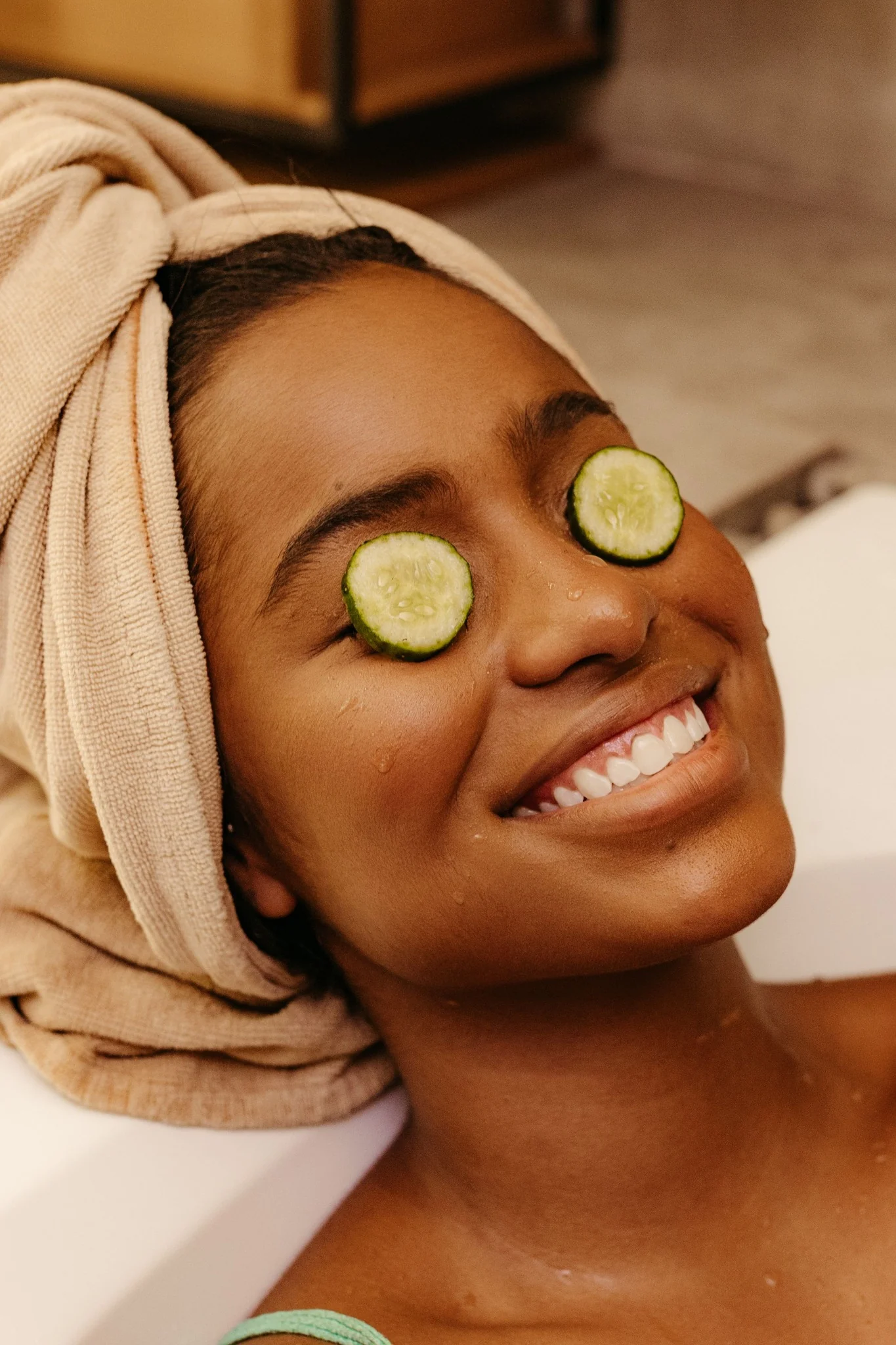 Smiling client enjoying a skincare and wellness treatment